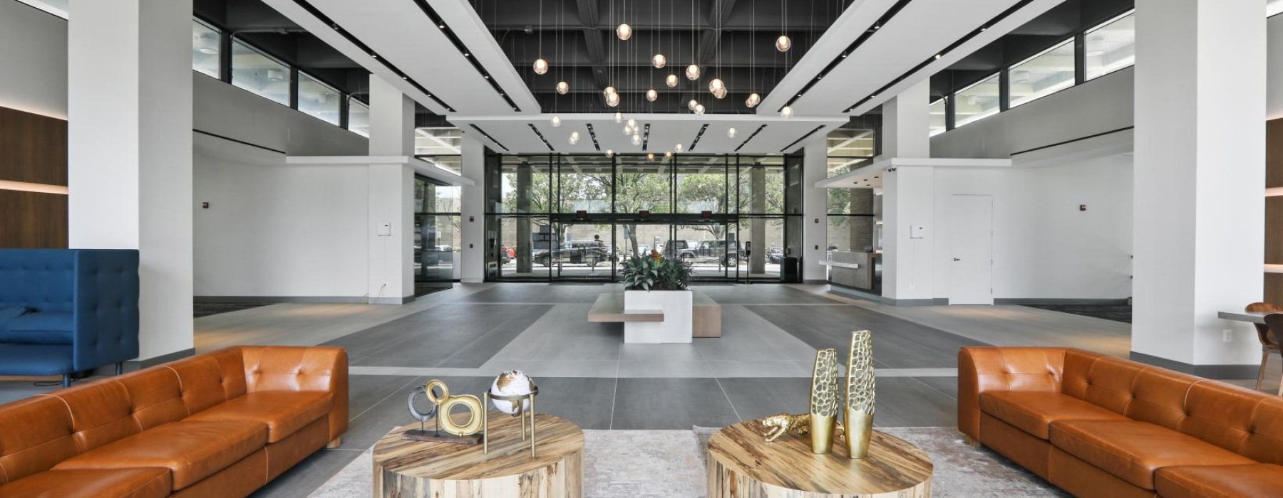 a room with a few couches and a table