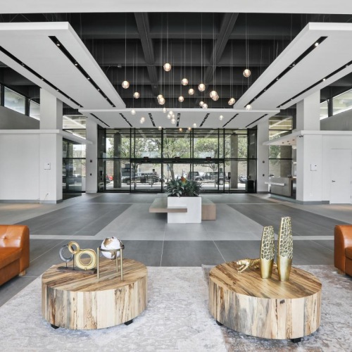 a room with a few couches and a table