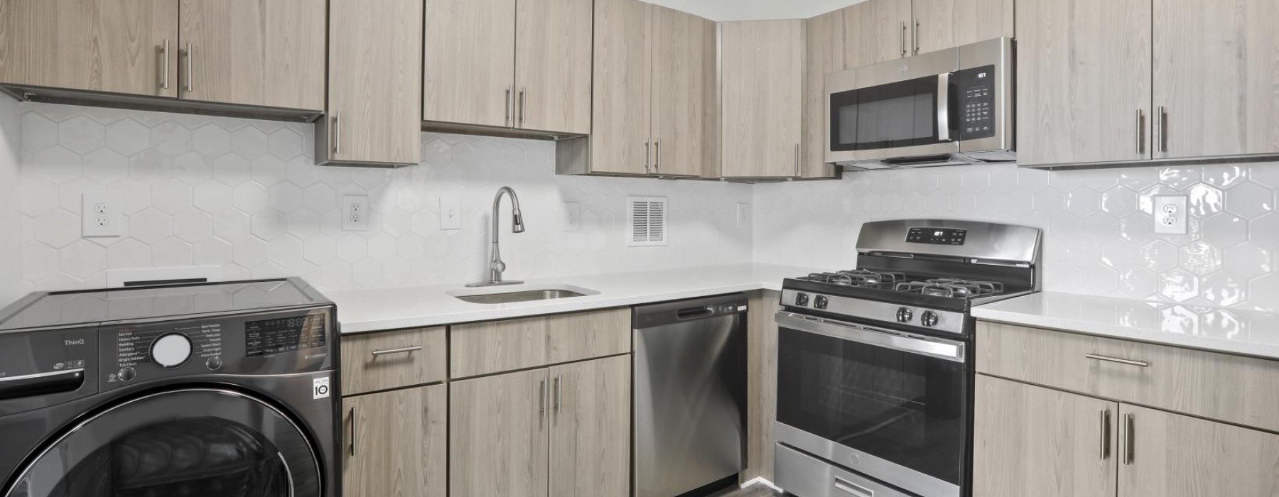 a kitchen with wooden cabinets
