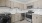 a kitchen with wooden cabinets