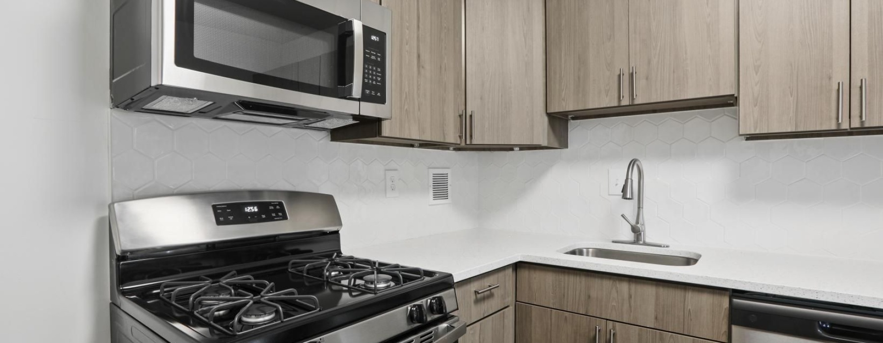 a kitchen with wooden cabinets