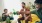 people with beer bottles in a living room
